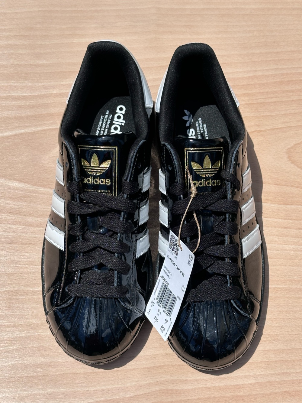 adidas Black and White Patent Leather Shell Toe Sneakers